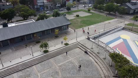 people walking carefree at the square in a summer morning