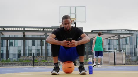 Basketball-player-using-mobile-phone-4k