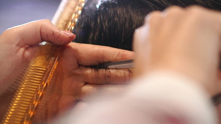 Barber Cuts the Hair in the Barbershop. Slow Motion. Close Up