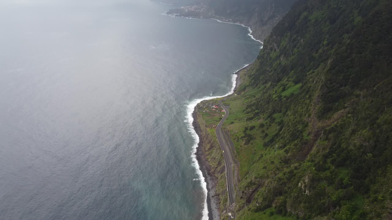 The view from Ribeira Da Janela looking down at the waves and the stormy skies