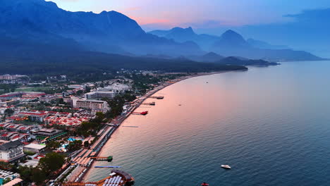Beautiful sea resort at the time of sunset. Drone flight over the beach of the Mediterranean Sea of Kemer, Turkey