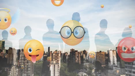 Animation-of-emoji-icons-flying-up-with-silhouetted-people-over-cityscape