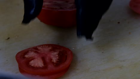 slicing tomatoes with a knife