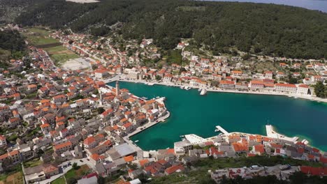 lovely medieval town of pucisca in croatia during summer - aerial drone shot