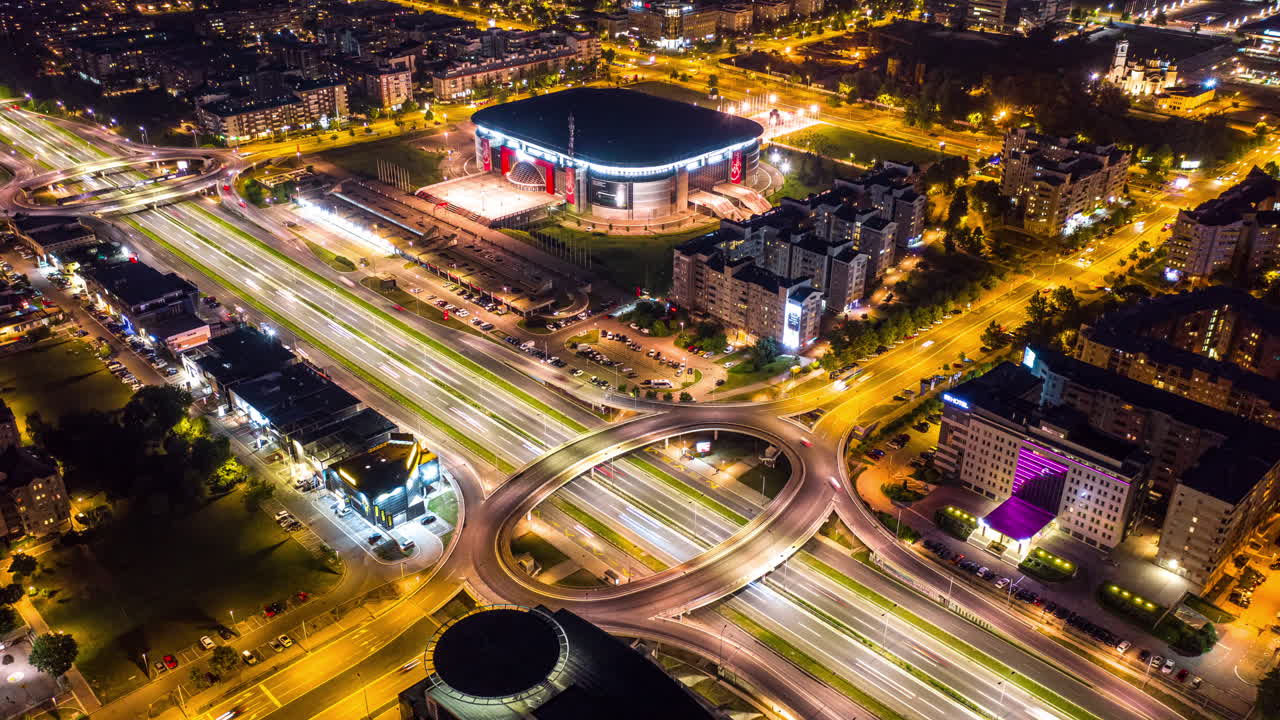 Aerial view of a stadium and city at night