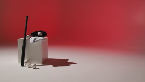 Studio-Baseball-Still-Life-With-Bat-Ball-Catchers-Mitt-And-Team-Jersey-With-Red-Lighting-1