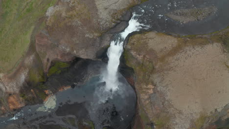 Overhead-view-of-the-jump-of-Haifoss-waterfall-in-Iceland.-Directly-above-one-of-the-most-famous-and-high-cascade-in-Iceland,-most-famous-travel-destination.-Haifoss-waterfall.-Amazing-in-nature
