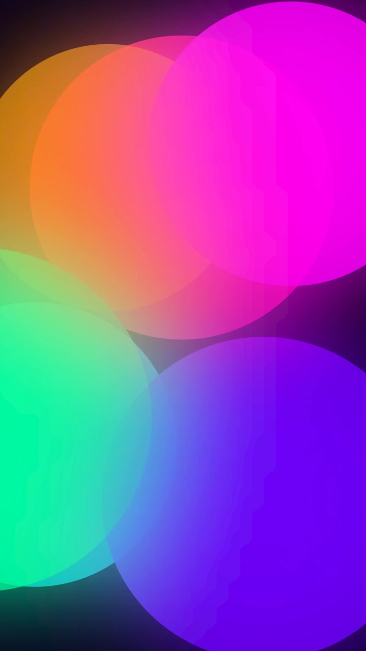 Abstract Animation of Colorful Glowing Circles Shrinking on Dark Background
