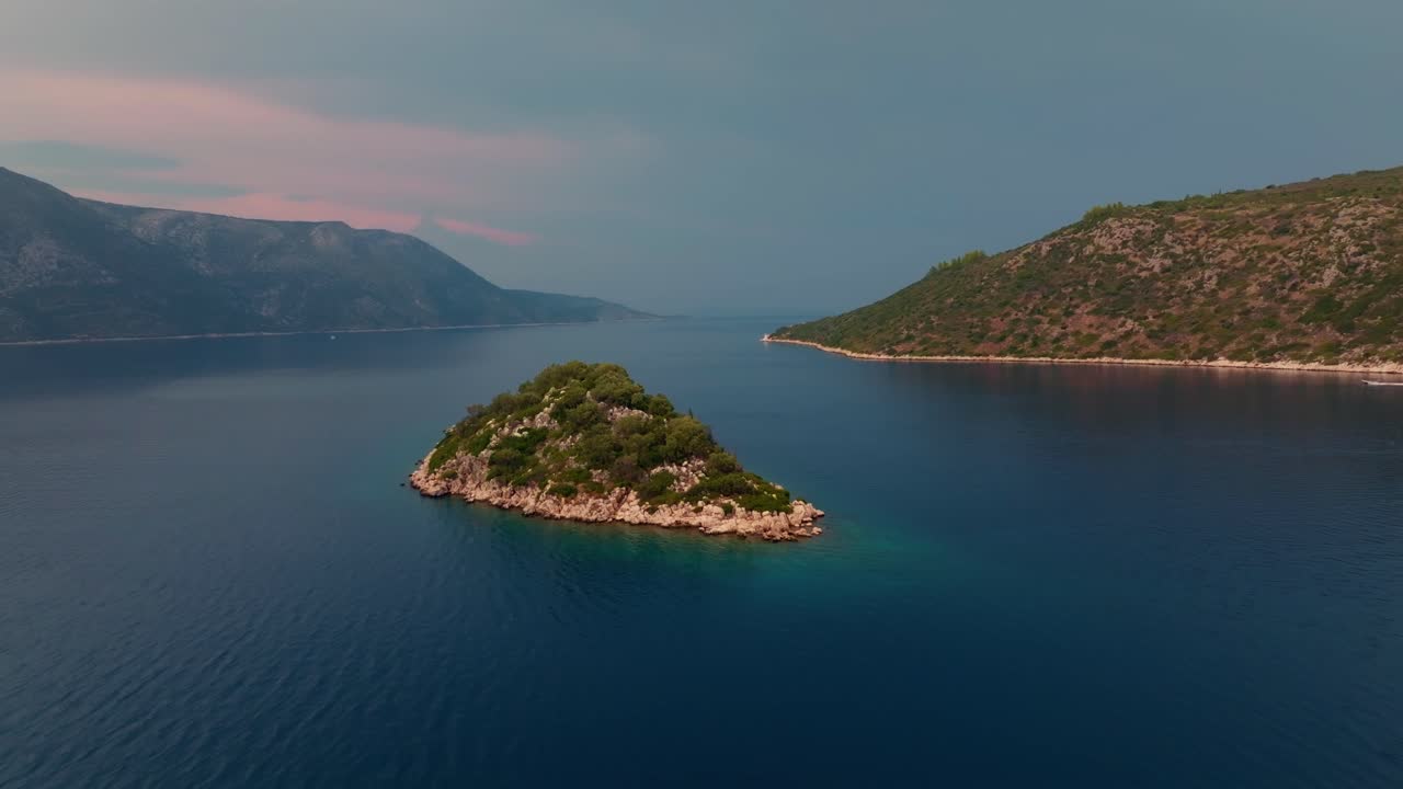 A cinematic aerial shot of an island of Ithaca in Greece