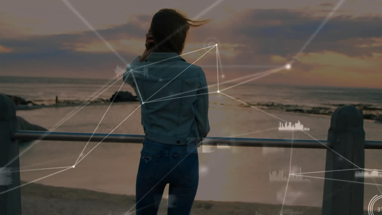 Woman standing by ocean at sunset with network connections animation overlay