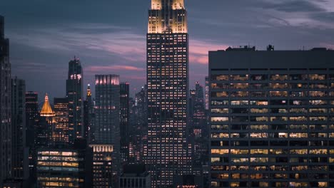 vertical ascend shot of the empire state building during sunset in midtown manhattan
