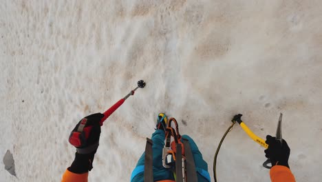 Hiker-walking-through-frozen-snow-with-crampons