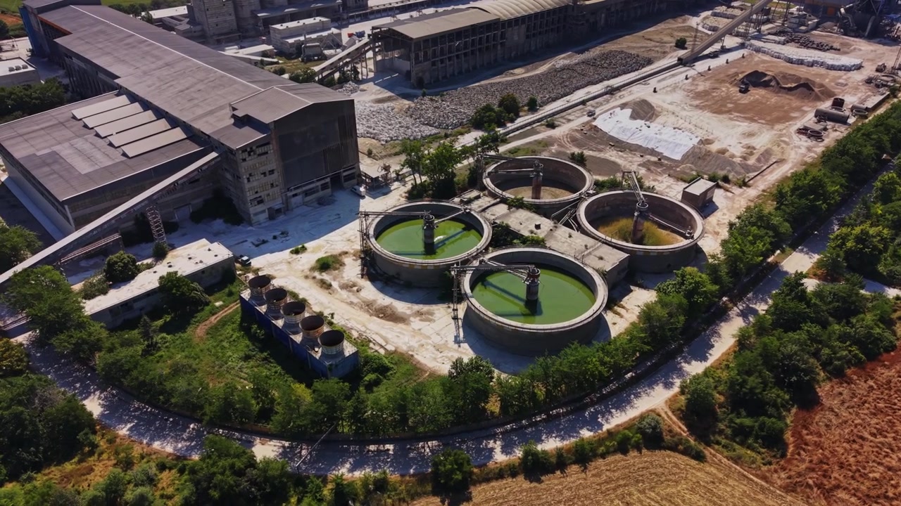 Industrial site with water treatment tanks in a rural area