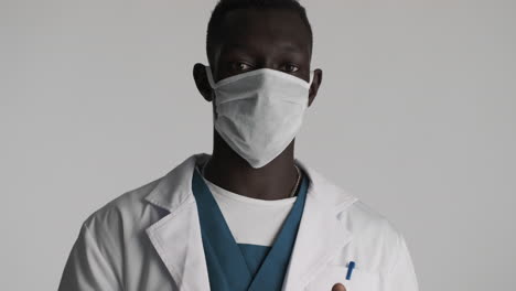 african american doctor on grey background.