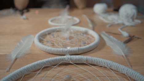 female hands creating dream catcher closeup