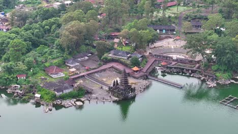hindu temple complex and pagoda on lakeside at pura segara ulun danu batur, bali, indonesia.