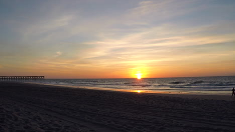 a time-lapse shot of wilmington beach, north carolina during the crack of dawn