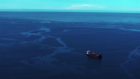 Ela-Beach-Port-Moresby-Papa-Papua-New-Guinea-Aerial-drone-cargo-ship-oil-rig-boat-blue-sky-stunning-sunny-morning-bay-coastline-hills-PNG-Capital-City-fishing-wharf-Harbor-Idlers-Bay-static-shot