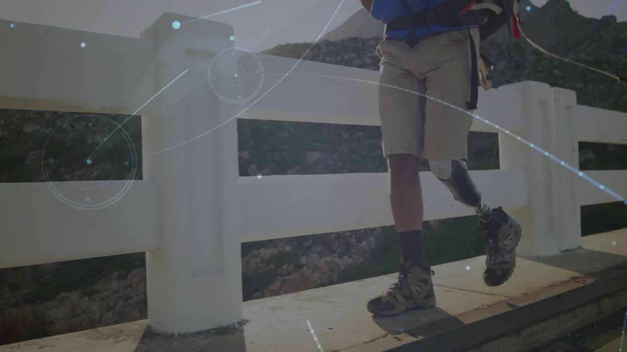 Man with prosthetic leg hiking over bridge, digital connections animation overlay