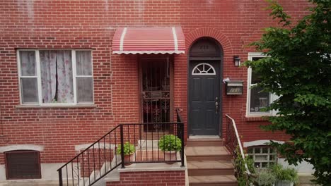 aerial pan across old fashioned philadelphia downtown city red brick wall residential doorway