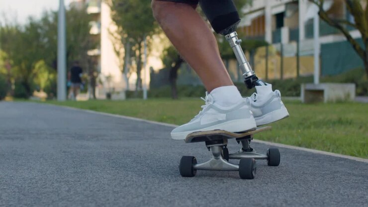 Close-up of man with prosthetic leg balancing on board