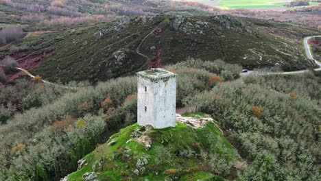 aerial orbit around castle-tower da pena in xinzo de limia, ourense, spain