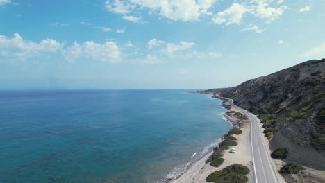 a breathtaking aerial view of a serene beach and crystal clear ocean waters