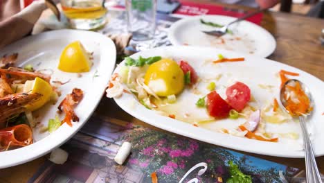 enjoying a meal with seafood and vegetables