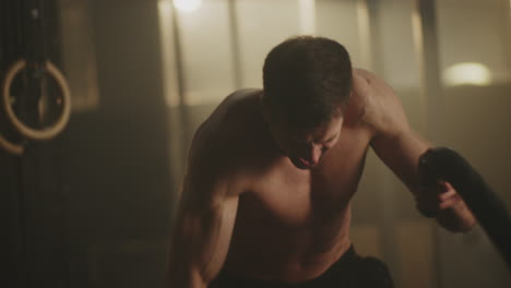 man working out with resistance rope