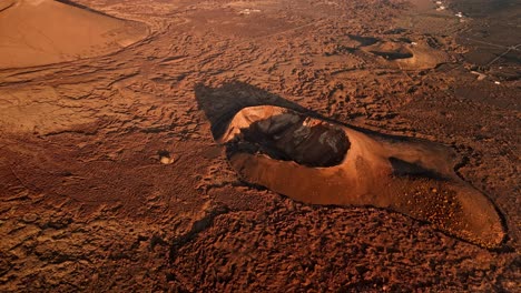 breathtaking aerial drone footage of volcano del cuervo at sunset in lanzarote, canary islands, spain.