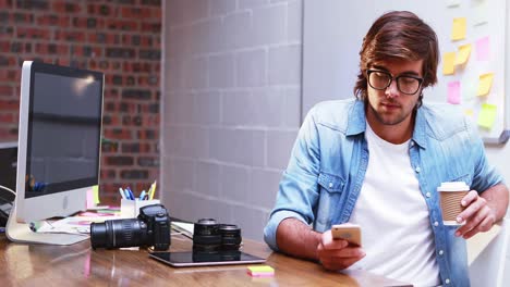 man text messaging on mobile phone