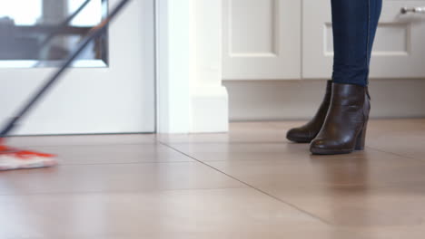 woman using the mop for cleaning