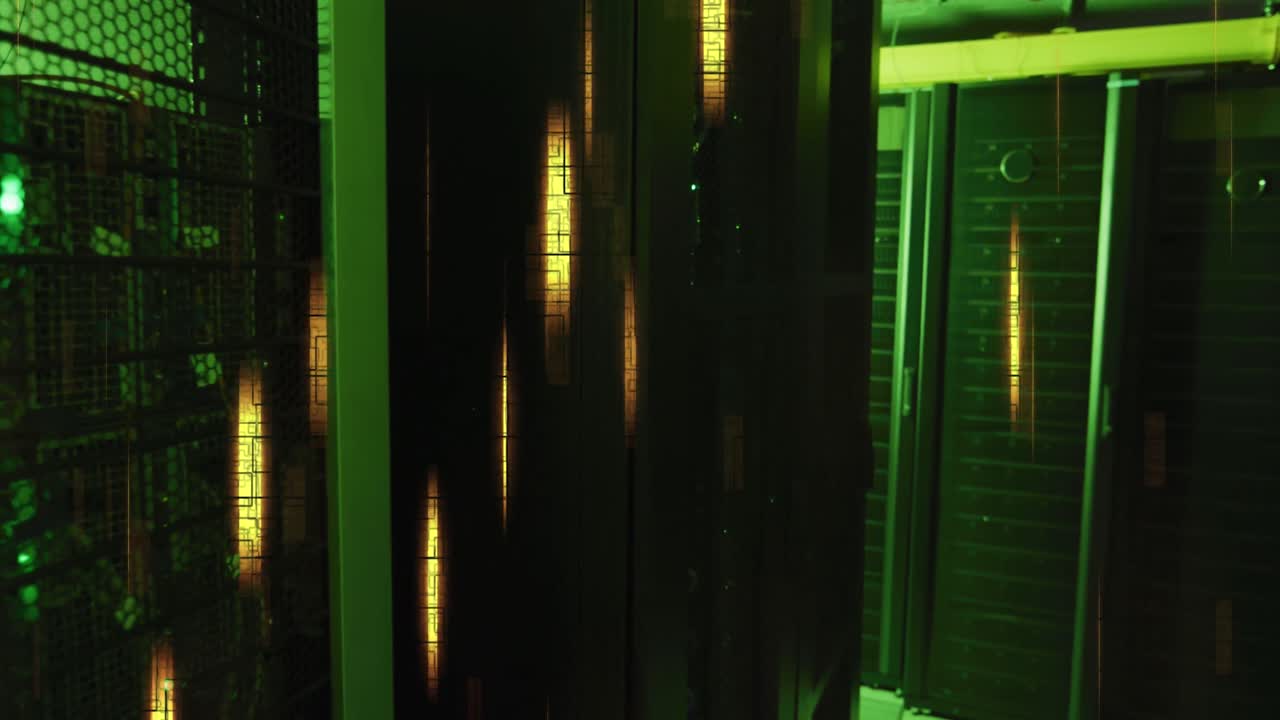 Glowing yellow lights and data processing over green lit, dark computer server room