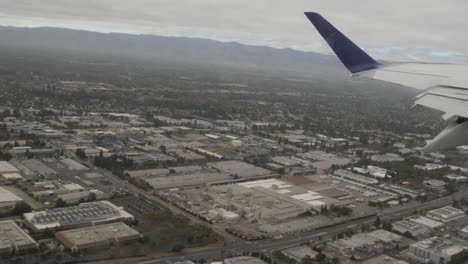 aerial view of san jose suburbs out of plane window 4k