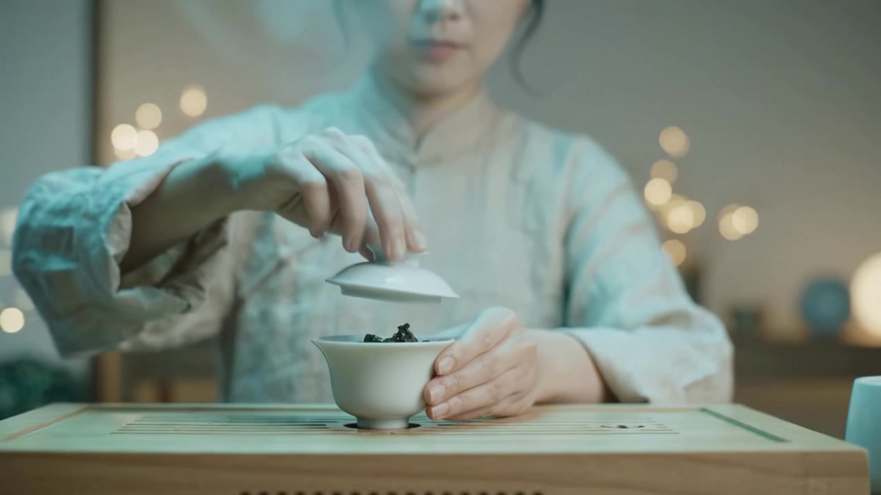 A Serene Moment of Tea Preparation: Capturing the Art of Traditional Tea Brewing with Focused Hands and Tranquil Surroundings in Soft Ambient Light