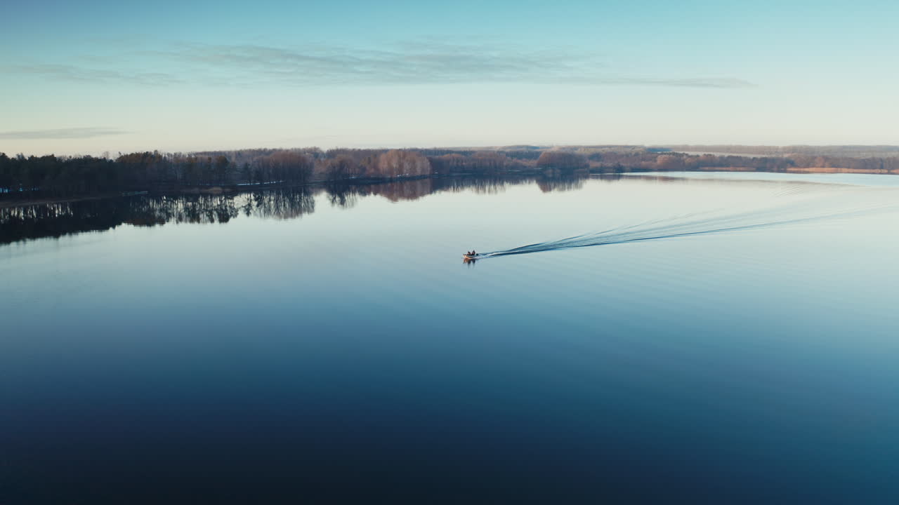 Sailing boat on the river. Aerial drone view of sailing boat on river against forest