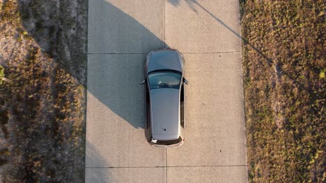 drone shot of a car on the street