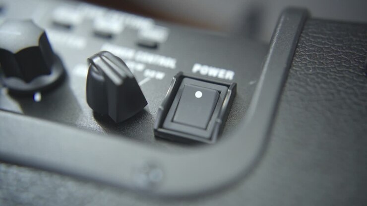 Pressing a power switch of an guitar amplifier