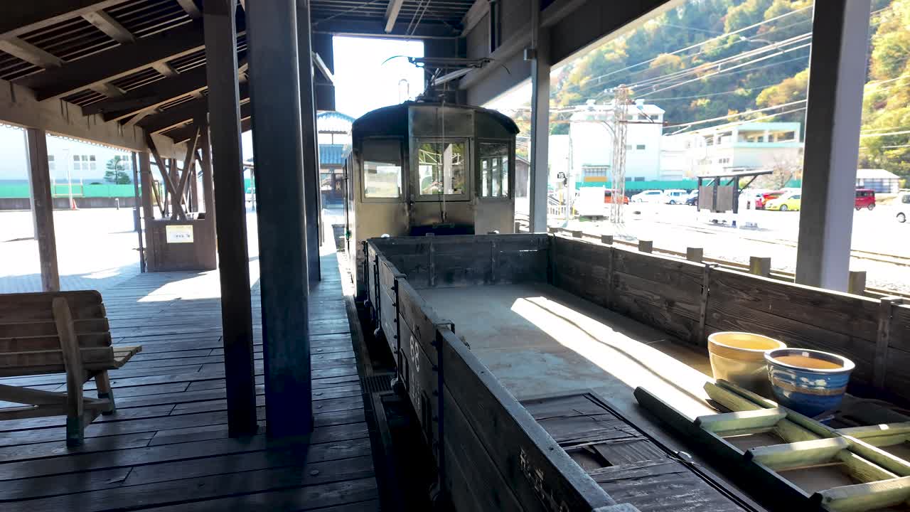 Old electric locomotive Tech 6 carrying a wooden wagon inside Katsuyama Station in Japan