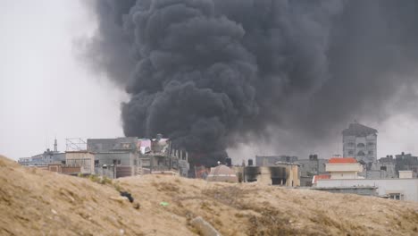 heavy smoke rising in air after an israeli missile attack on the gaza strip in israel hamas war