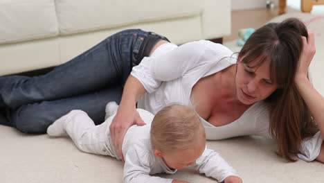 woman lying with a baby