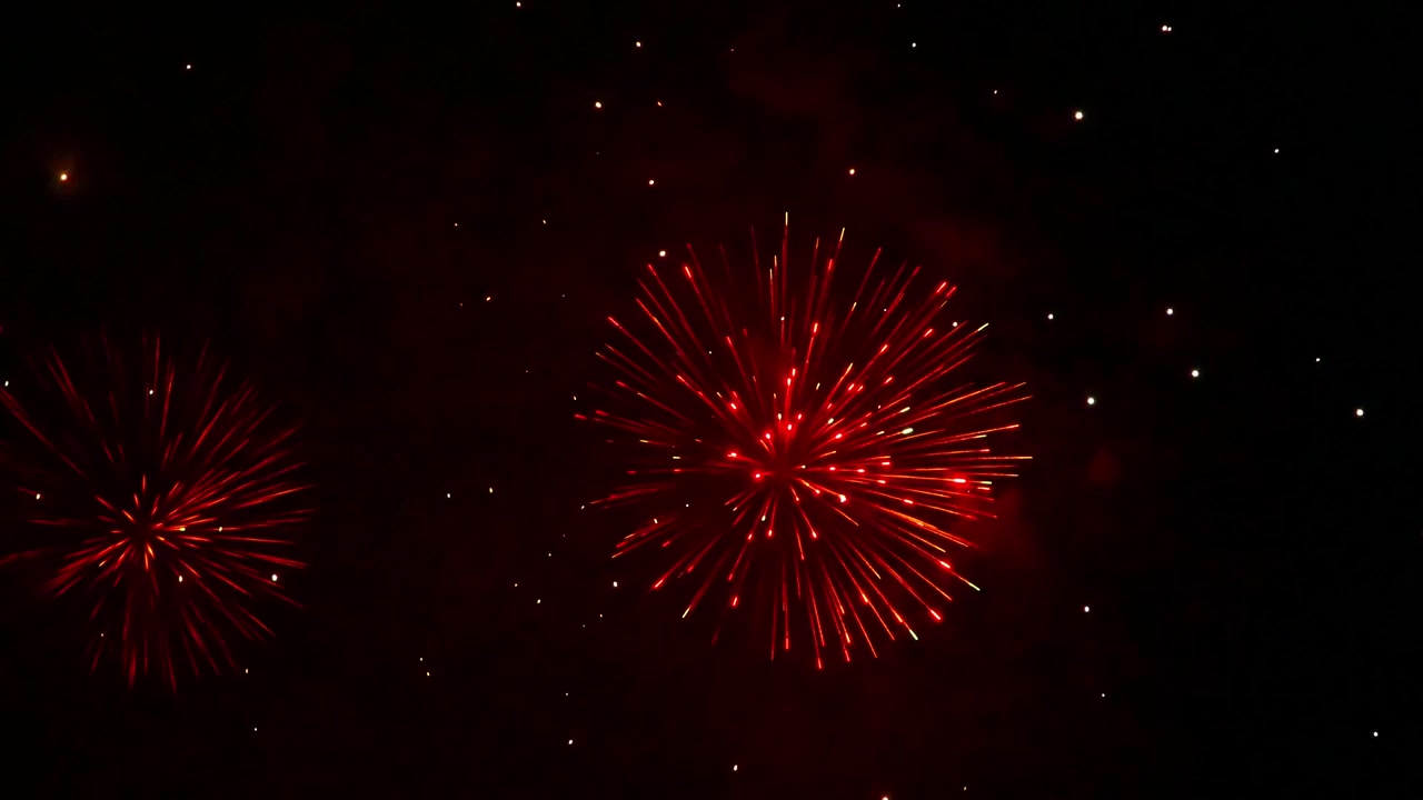 五彩繽紛的煙花在夜空中綻放，以璀璨的火花、閃爍的軌跡和絢麗的光影圖案，營造出壯觀的節日氣氛。