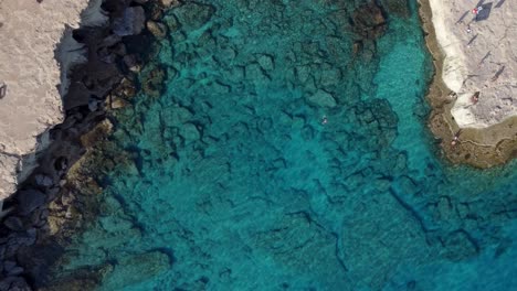 Revealing-Top-View-of-Sea-Caves-Bay-In-Cyprus,-Mediterranean-Sea