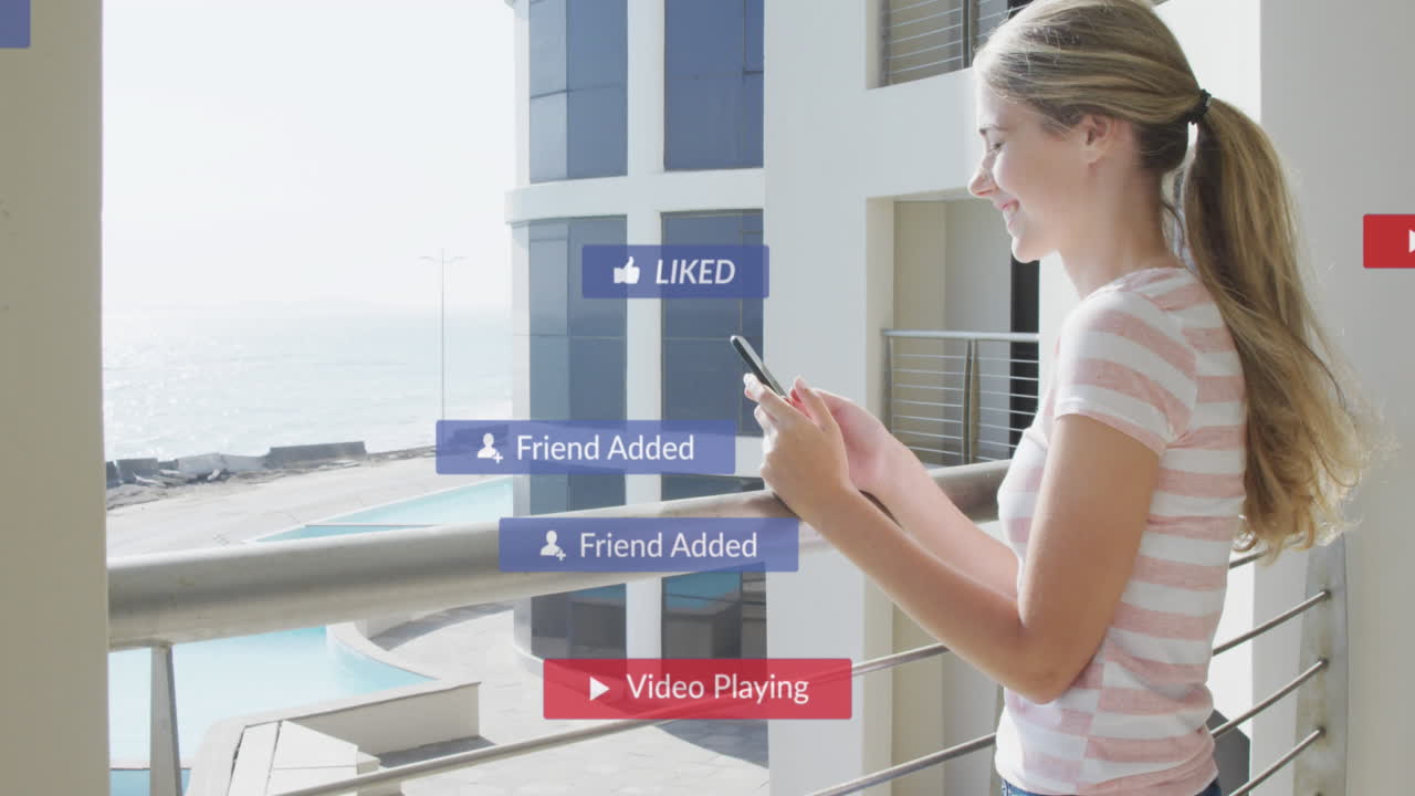 Animation of social media icons over happy woman using smartphone on balcony