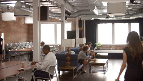 interior of busy modern office with staff working