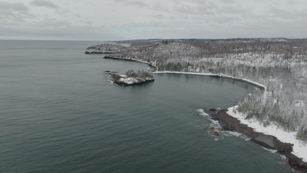 Split Rock Lighthouse State Park, Ellingson Island And Lake Superior in Winter. - aerial shot
