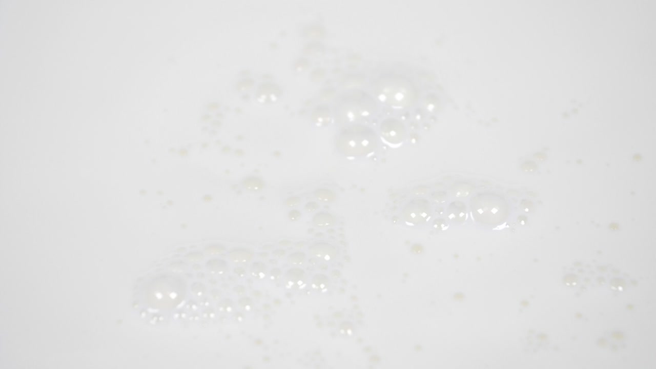 Pouring fresh milk in super slow motion 4k