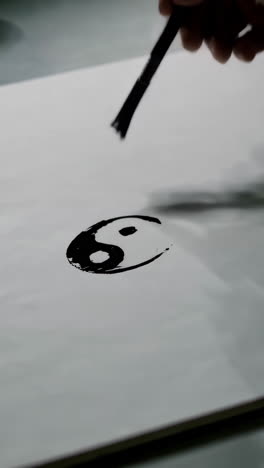 yin yang painting with brush