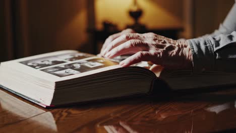 elderly person looking through a photo album