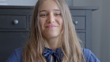 closeup, caucasian young woman looking at camera and smiling